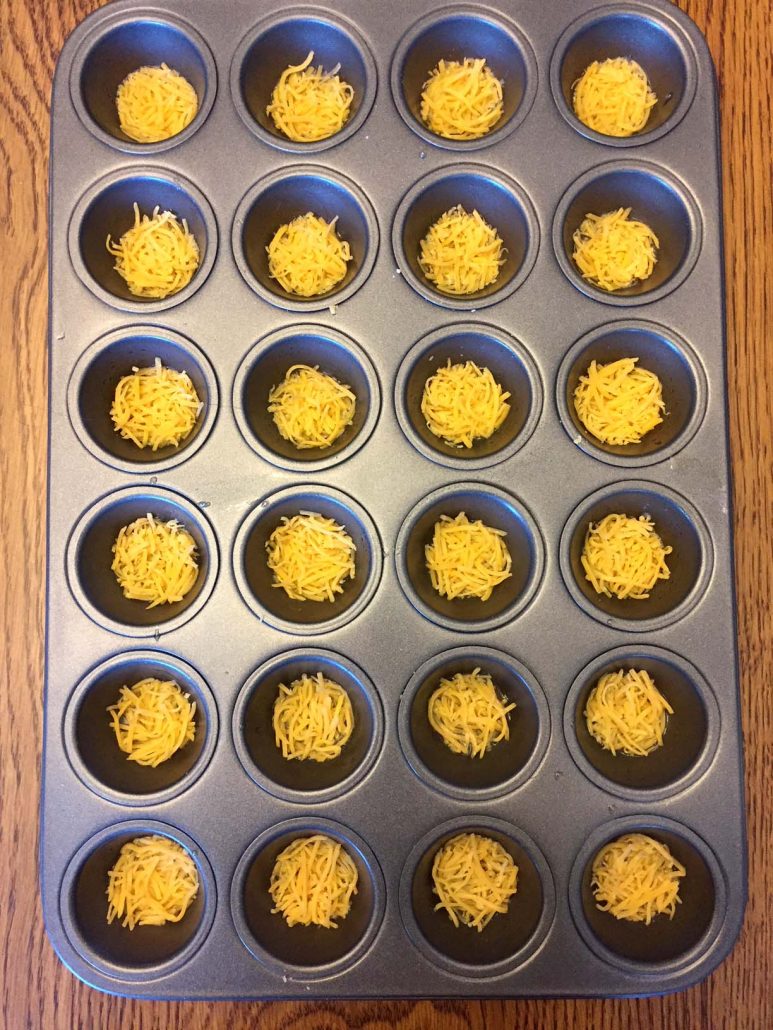 Shredded Cheese In Mini Muffin Pan For Keto Chips