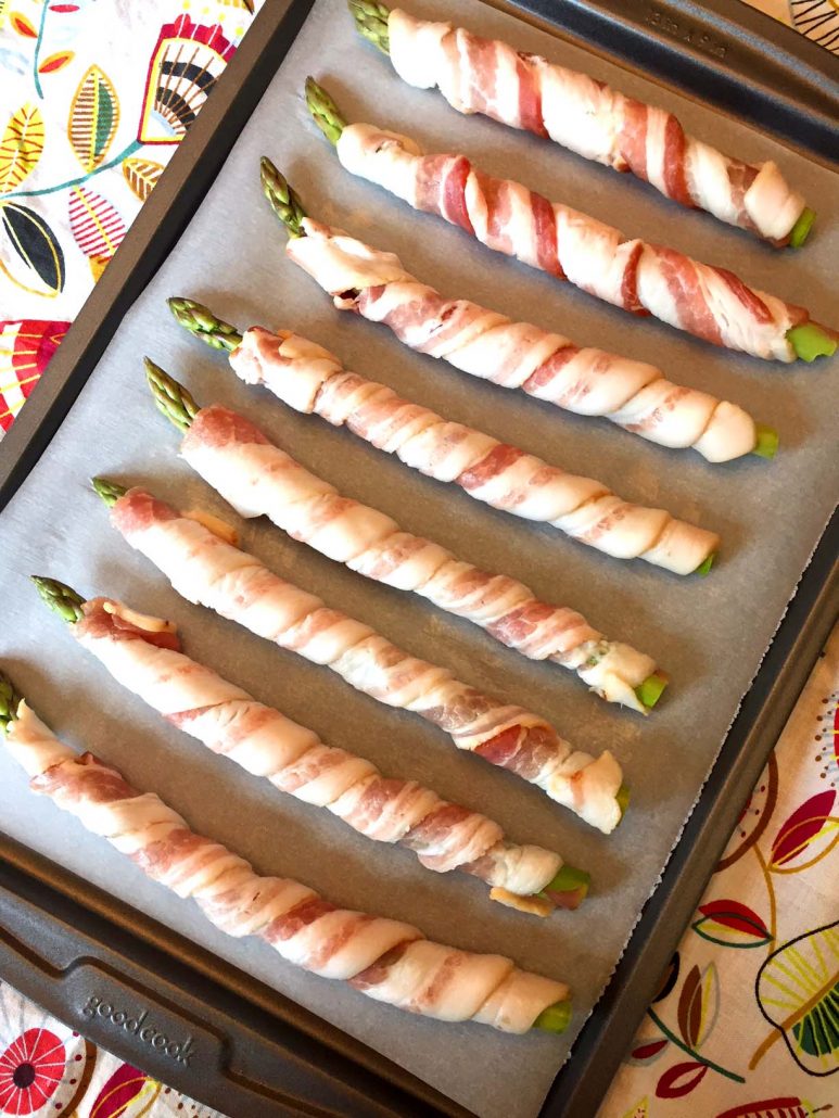 Bacon Wrapped Asparagus On A Baking Sheet