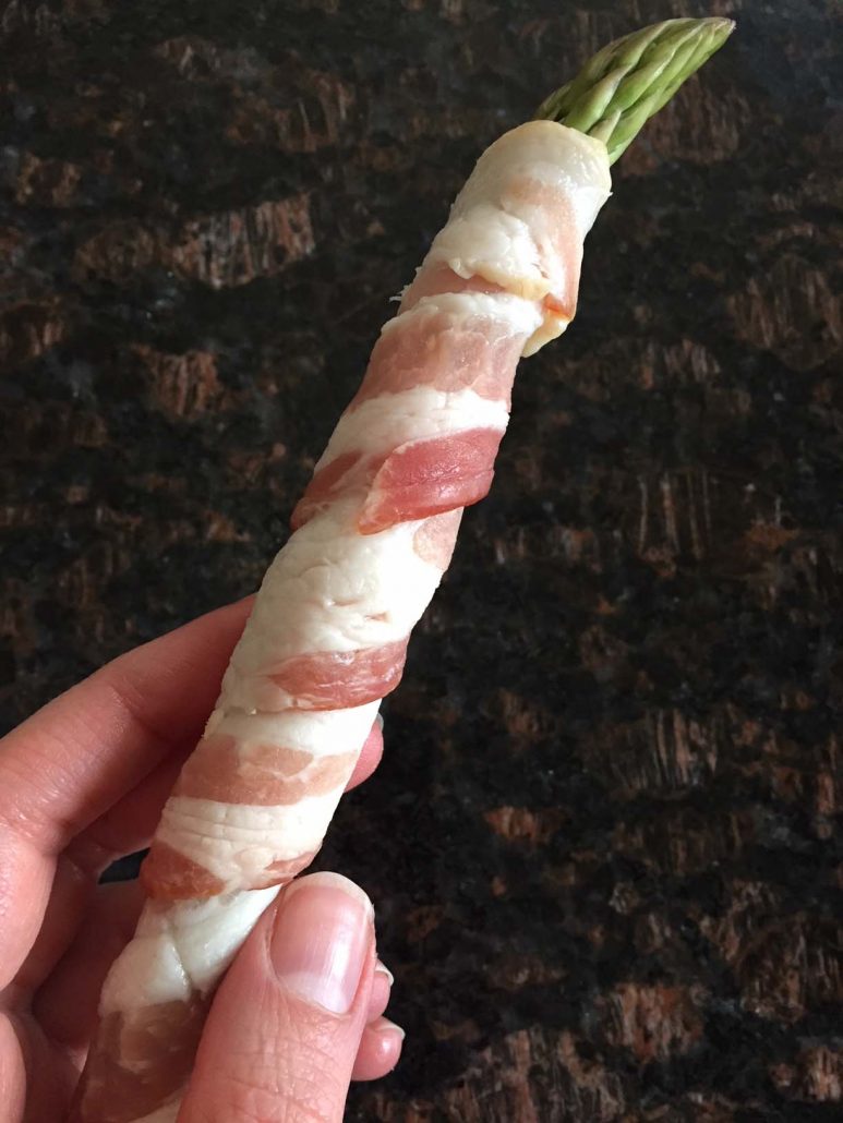 Stalk of asparagus wrapped in bacon