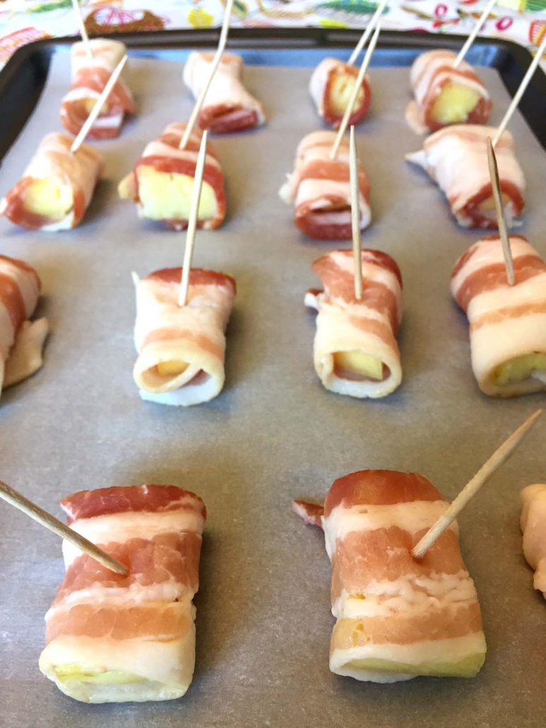 Bacon Wrapped Pineapple On A Baking Sheet