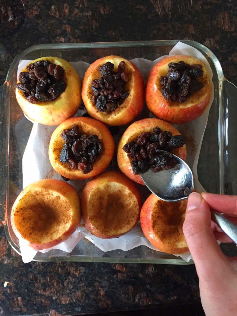 Stuffing apple with raisins for baking