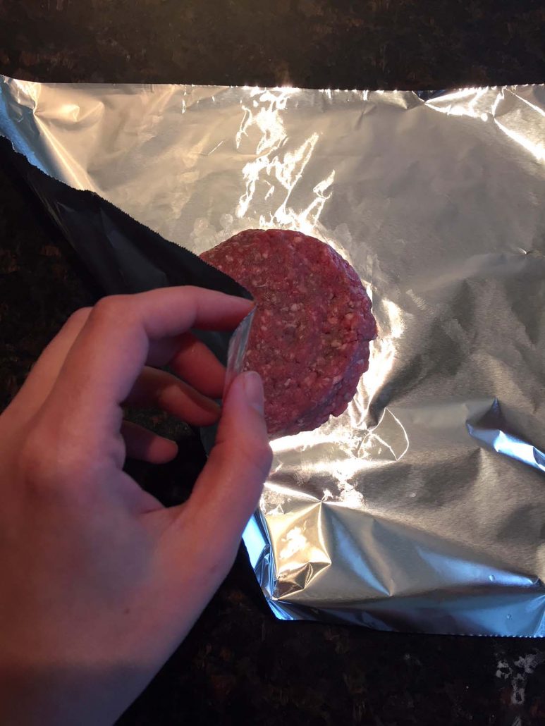 Burger patty wrapping in foil