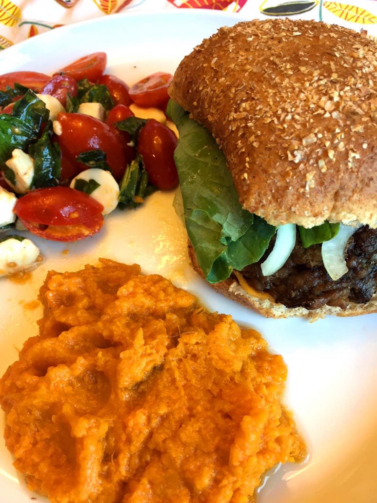 Burger and mashed sweet potatoes dinner