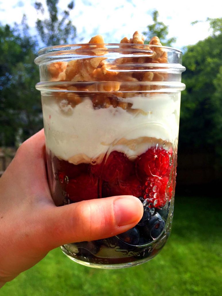 Low-carb yogurt parfait breakfast with berries and nuts