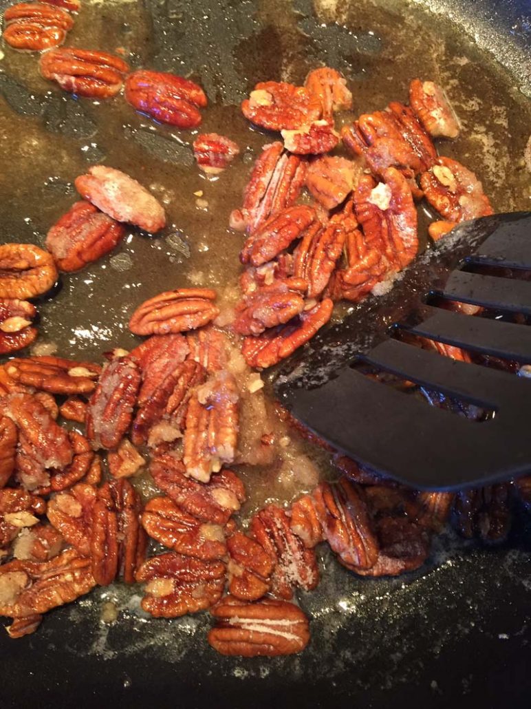 Keto Candied Pecans on a frying pan