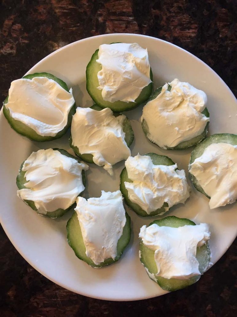 Cucumber slices spread with cream cheese