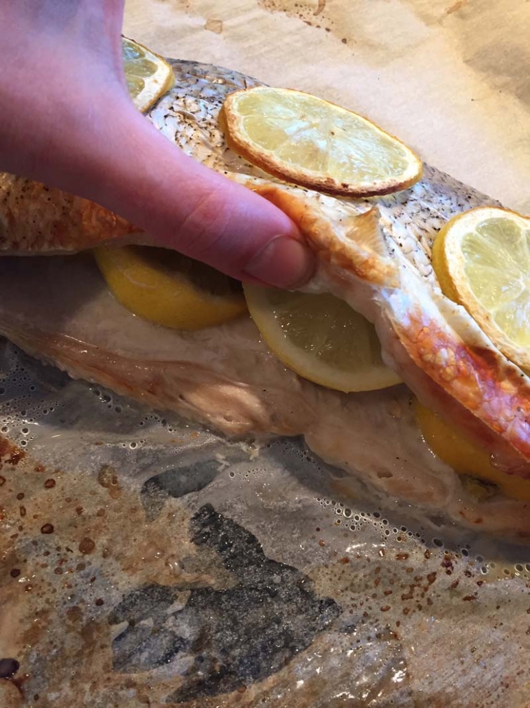 stuffing whole whitefish with lemons