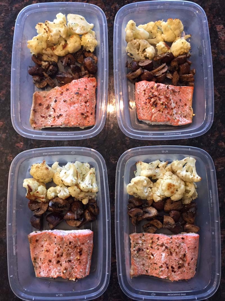 keto meal prep containers with salmon cauliflower mushrooms