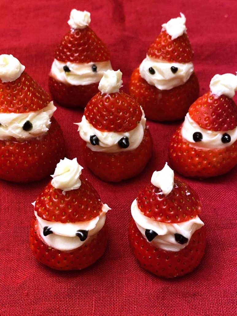 strawberry santa hats with whipped cream and marshmallows