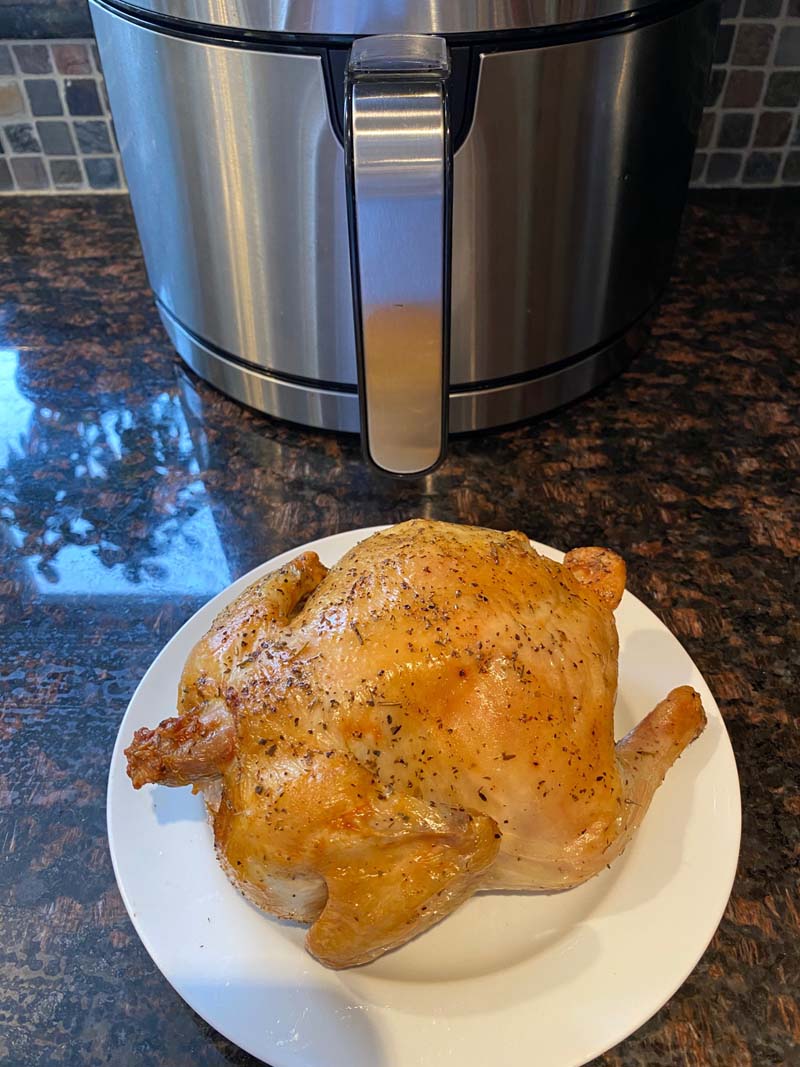 air fryer cornish hen on a white plate