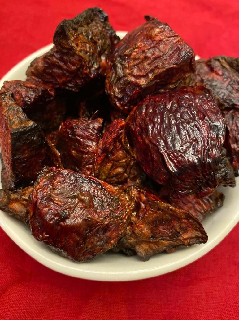 roasted beets in a white bowl