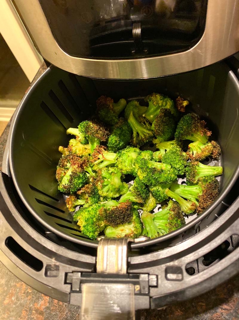 cooking roasted broccoli in an air fryer