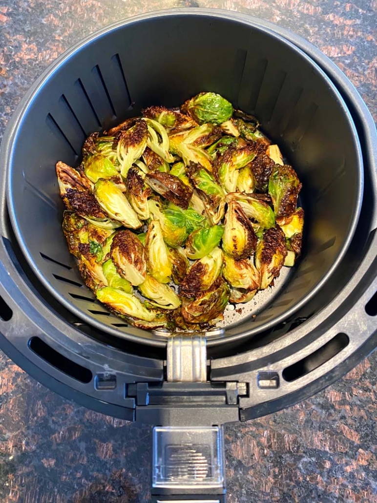 roasted brussel sprouts in an air fryer basket