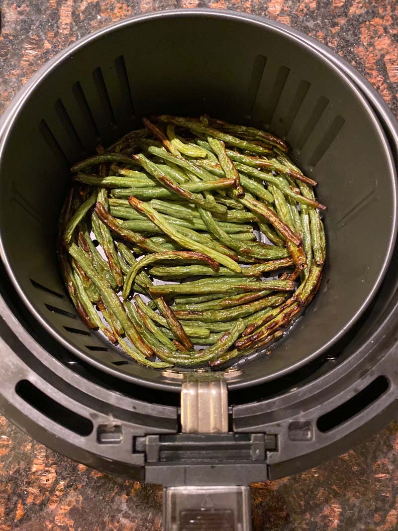 Air Fryer Green Beans in air fryer basket on a countertop