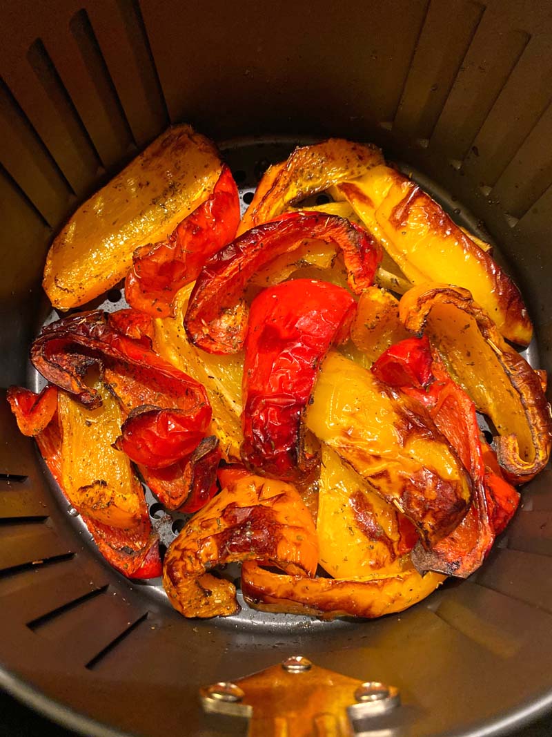 roasted bell peppers in an air fryer basket
