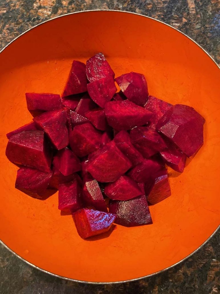 chopped raw beets in an orange bowl