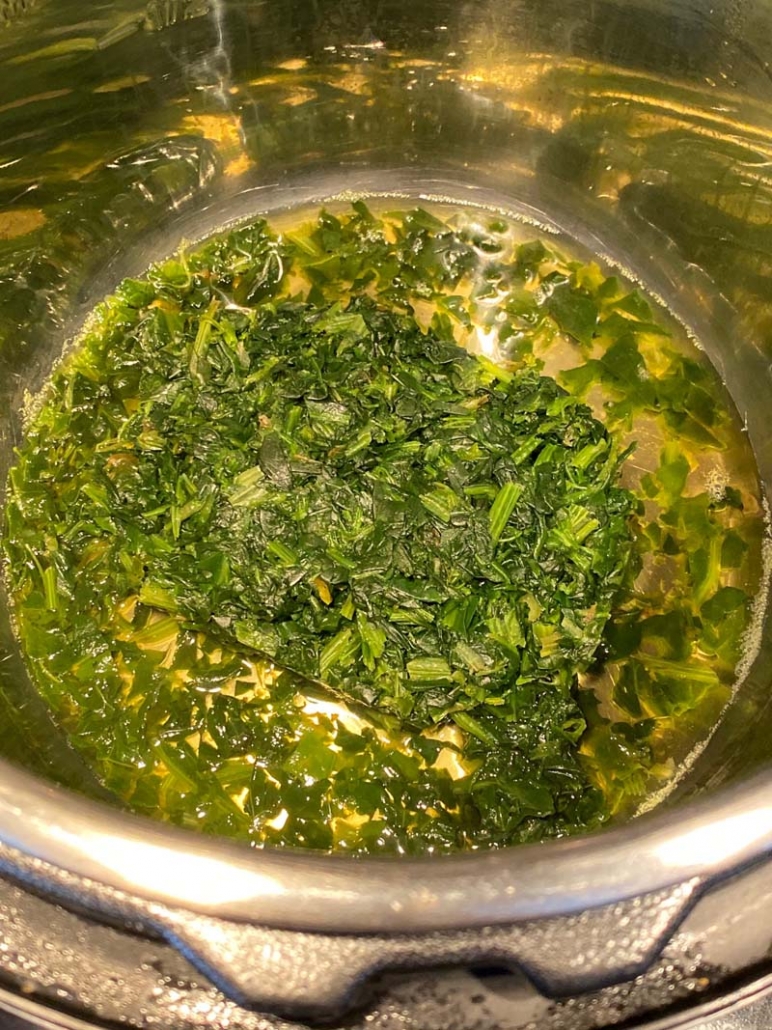 frozen spinach cooking in an instant pot