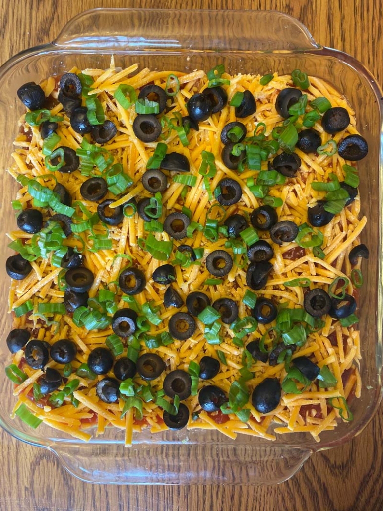 shredded cheese, olives and green onions