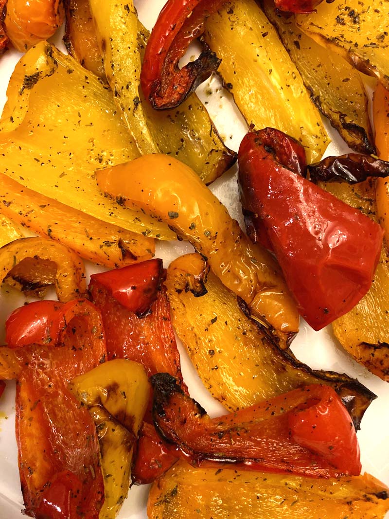 Close up shot of red, yellow, and orange bell peppers that were roasted in an air fryer.