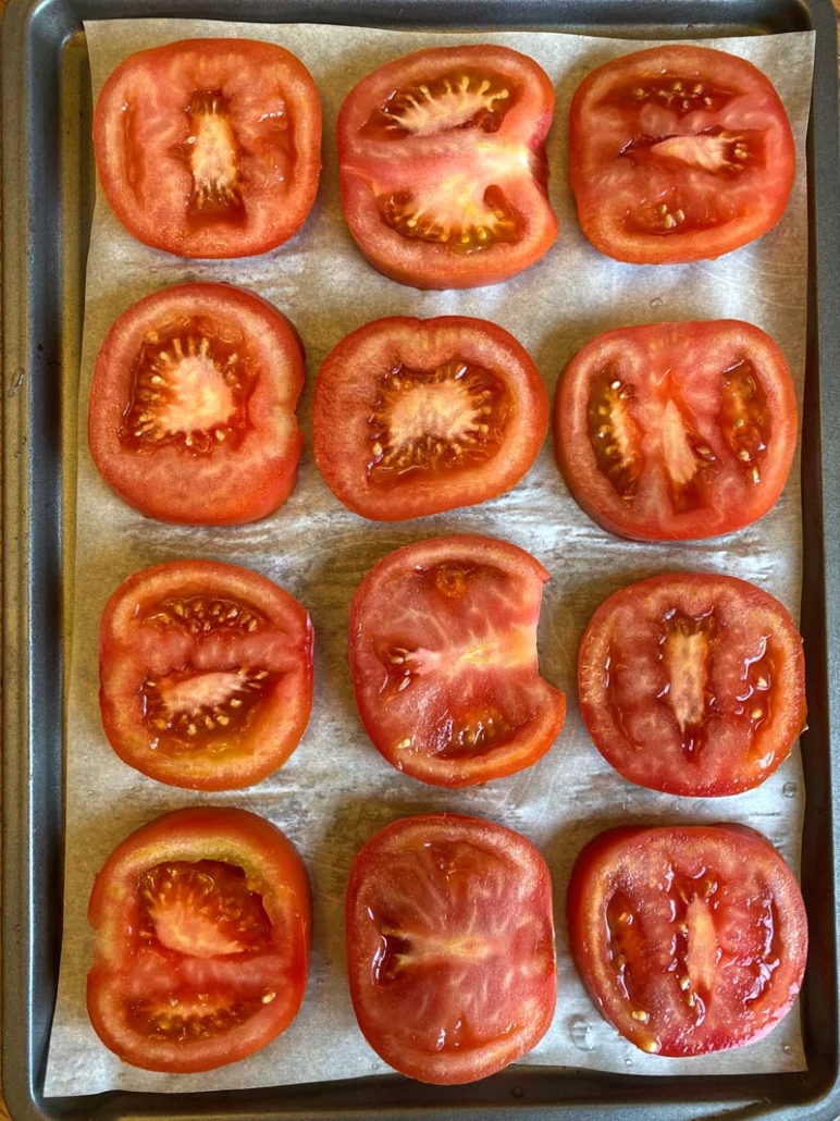 tomato slices on a baking sheet