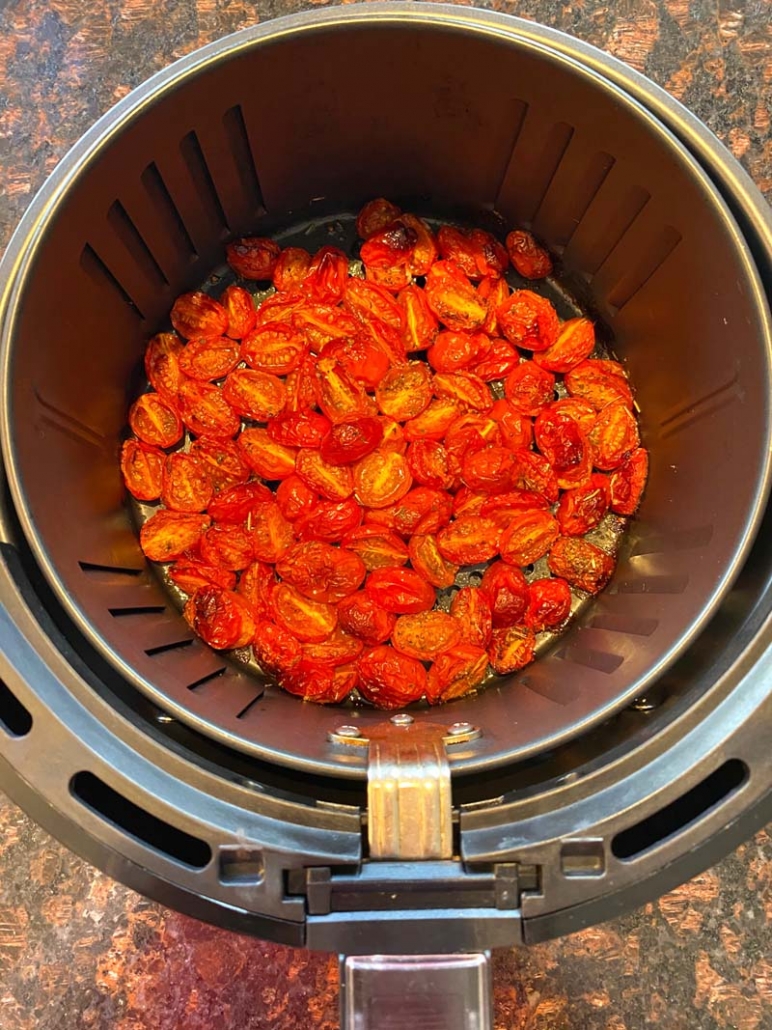 air fryer roasted cherry tomatoes in an air fryer basket