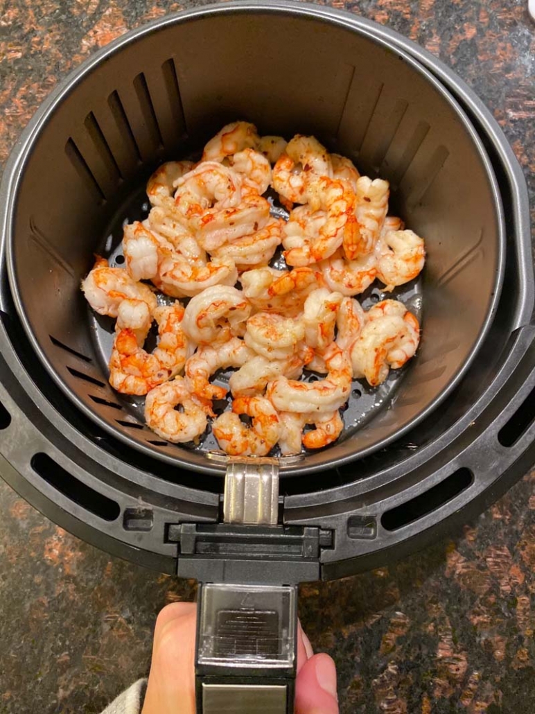 Cooked Frozen Shrimp in an air fryer basket