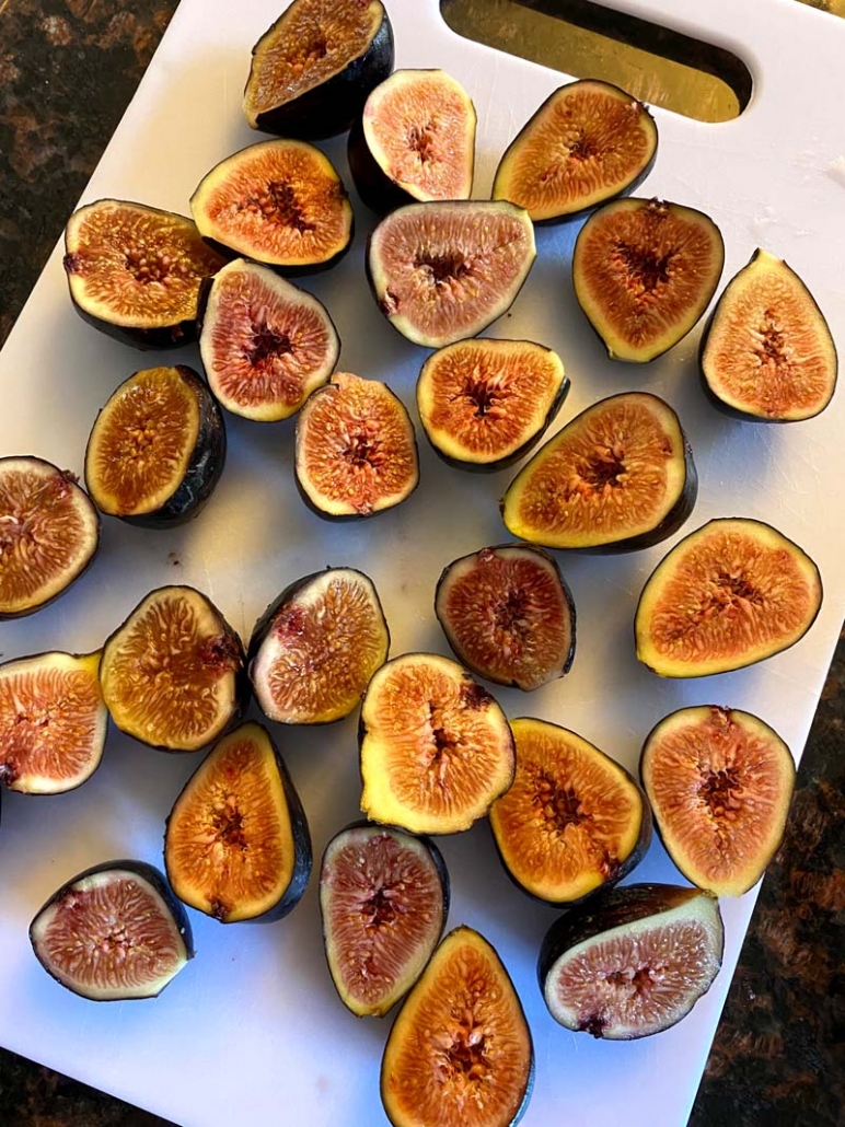 prepping and cutting fresh figs to be cooked 