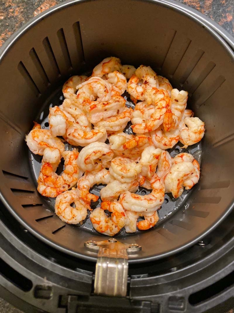 air fried shrimp in a black air fryer basket