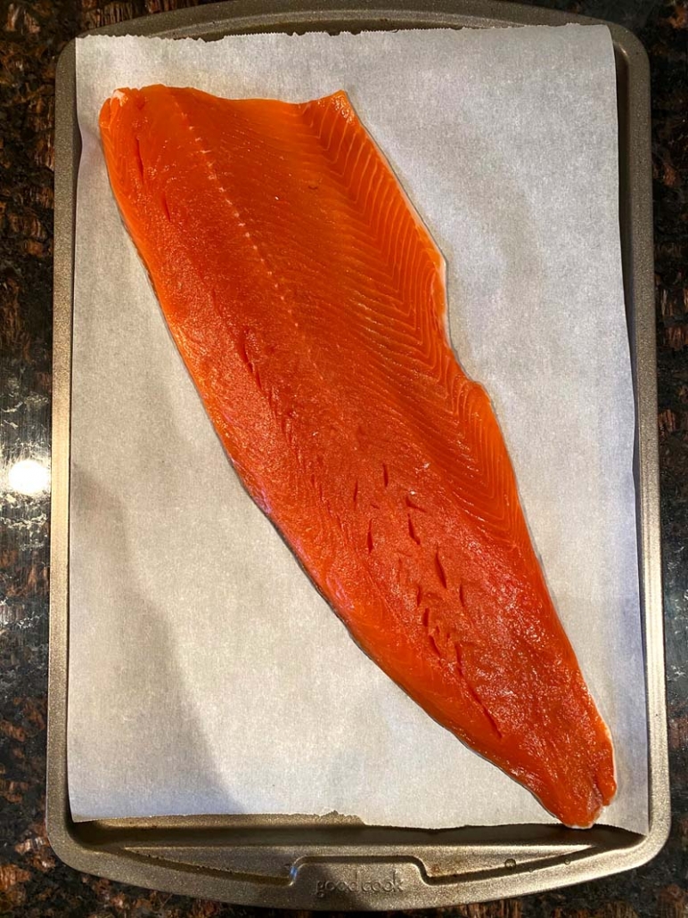 large salmon fillet on a baking sheet