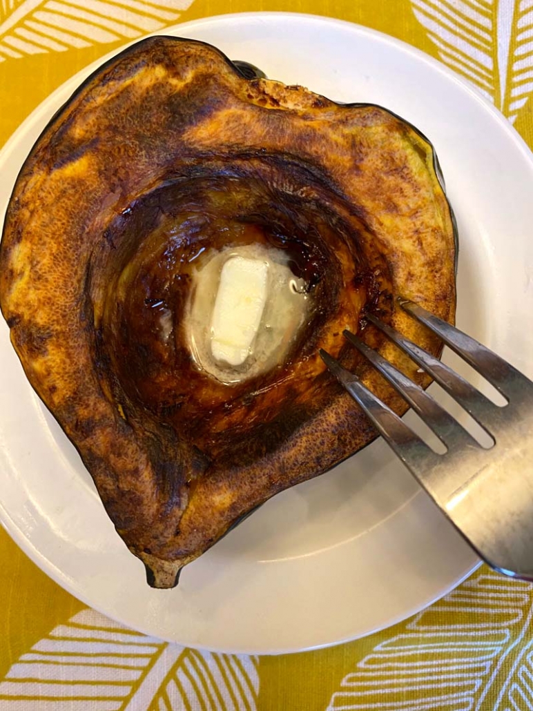 roasted acorn squash half on a plate