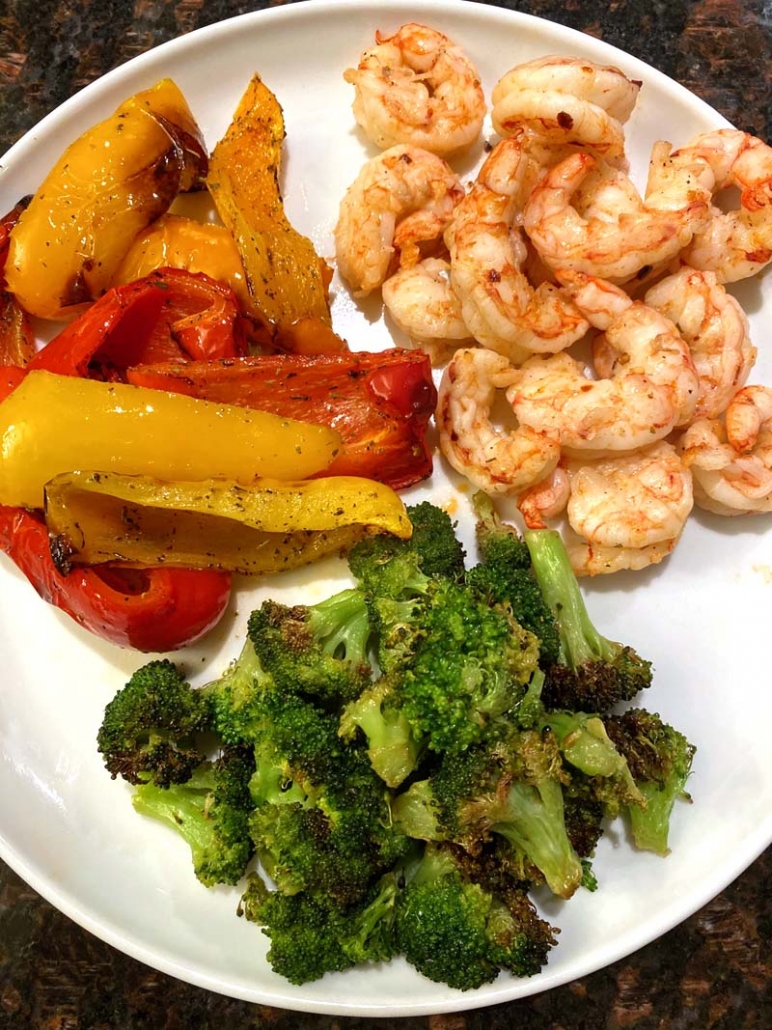 air fried shrimp served with roasted bell peppers and roasted broccoli 