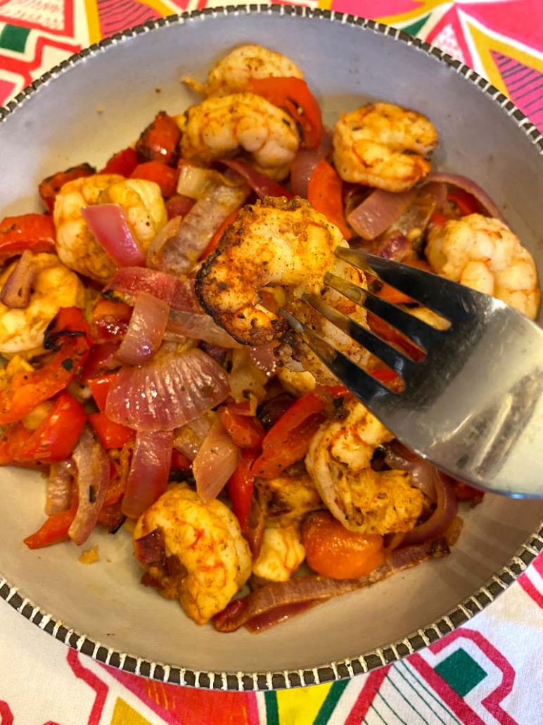 Eating air fried shrimp fajitas with a fork 