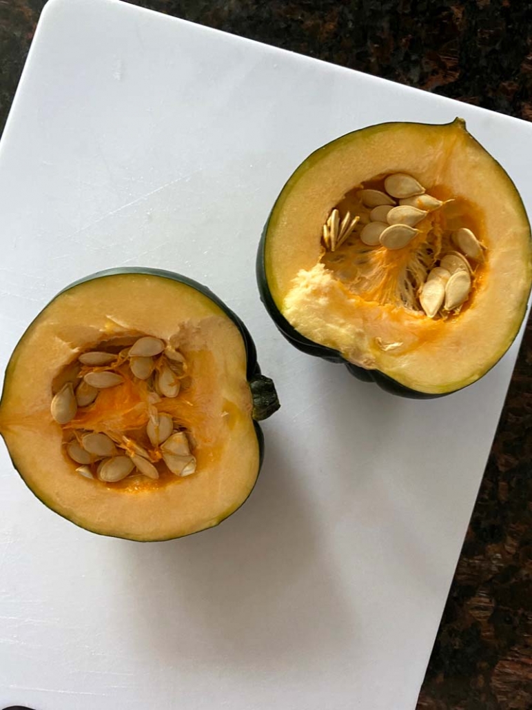 halved acorn squash with seeds