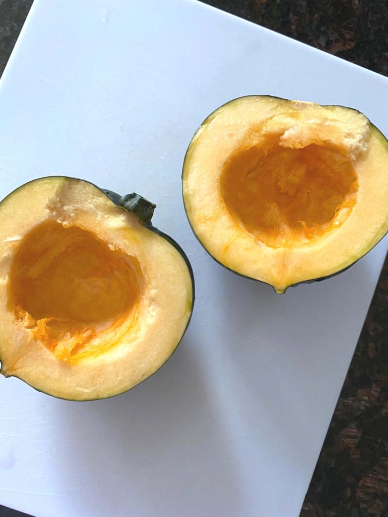 halved acorn squash with scooped out centers