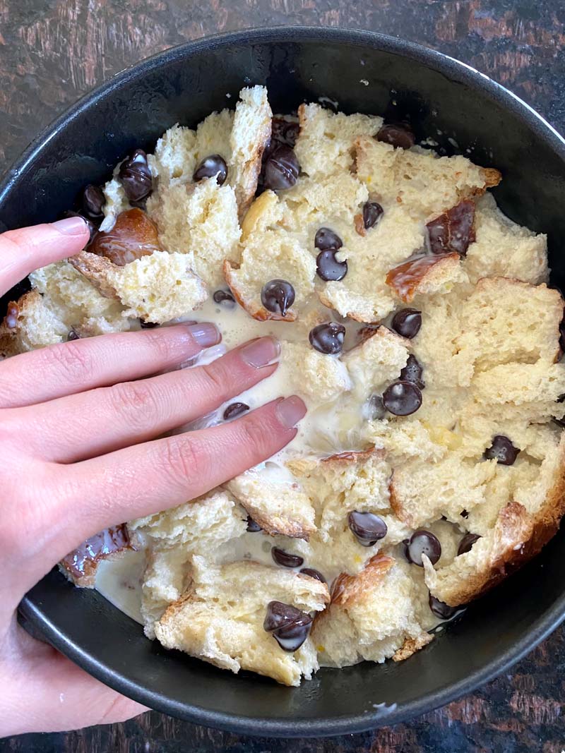 Pressing the bread into the tin