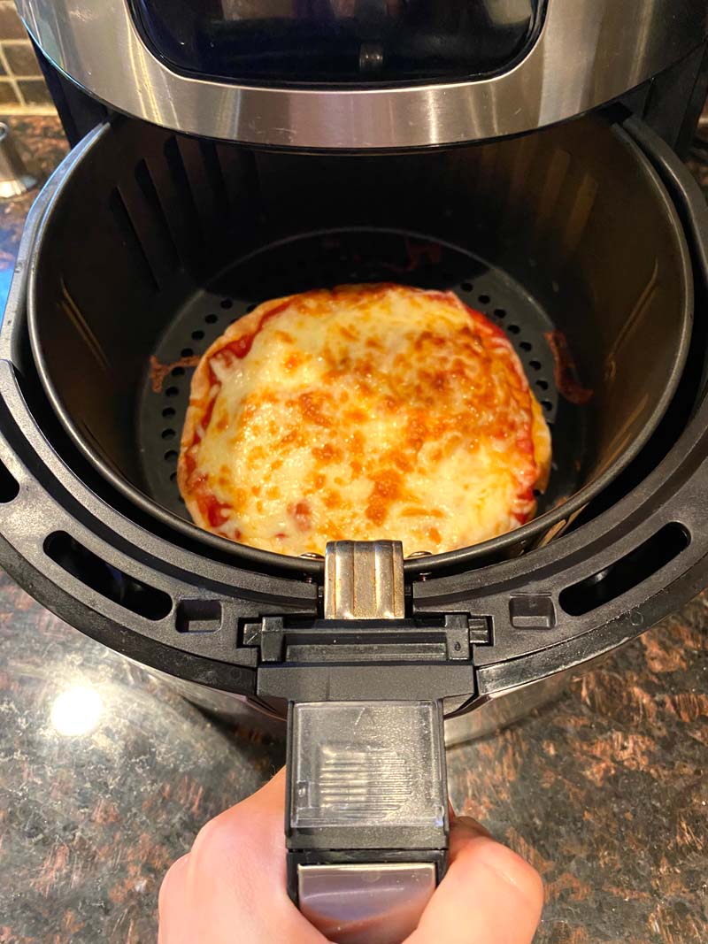 Removing the basket of the air fryer