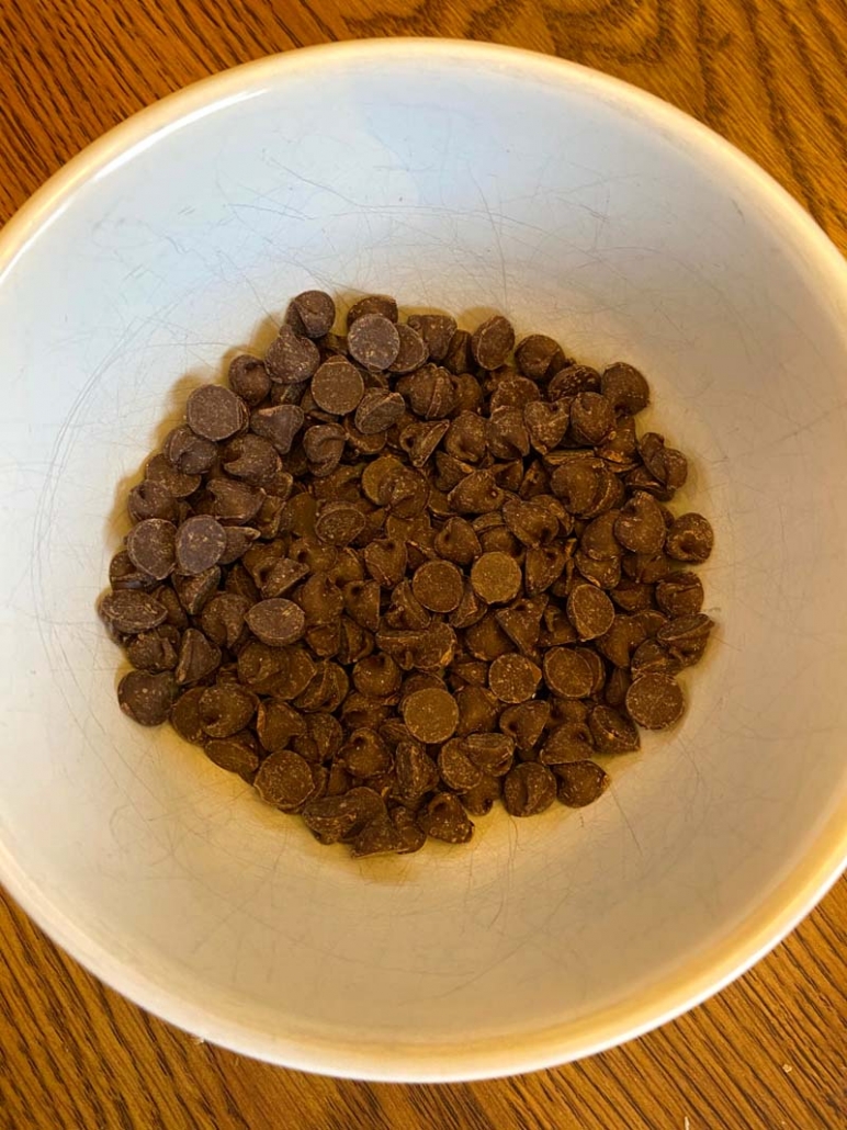 chocolate chips in a white bowl