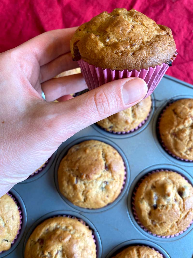 A cranberry sauce muffin in a pink paper liner