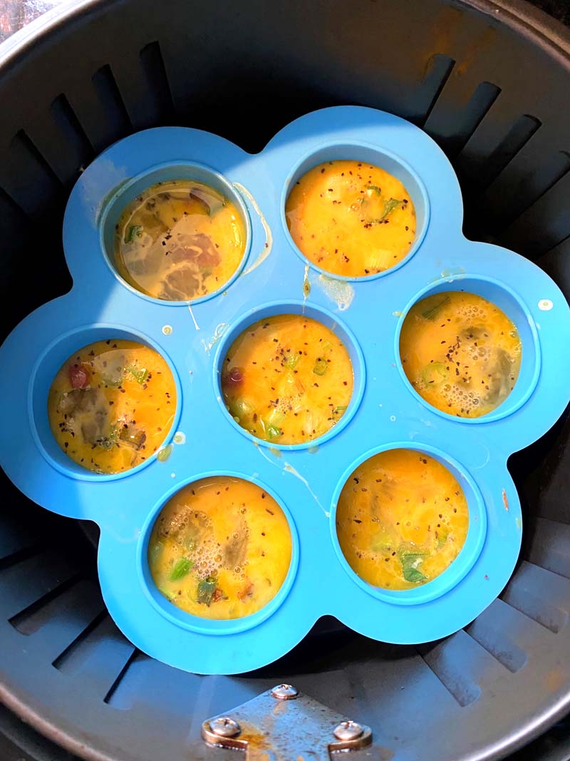 Eggs bites in a mold in the air fryer basket