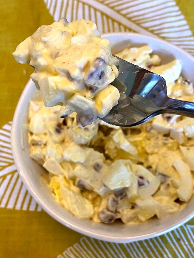 eating egg salad with a fork 