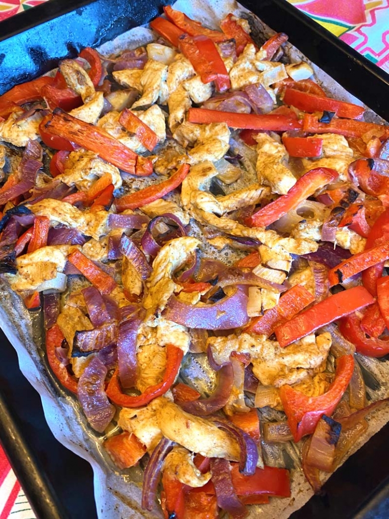 chicken fajitas baked on a sheet pan