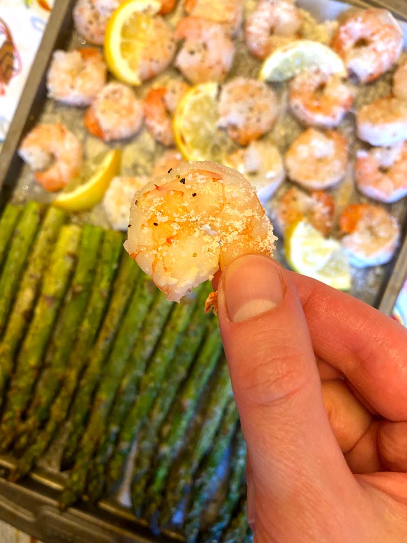 A shrimp being held towards camera