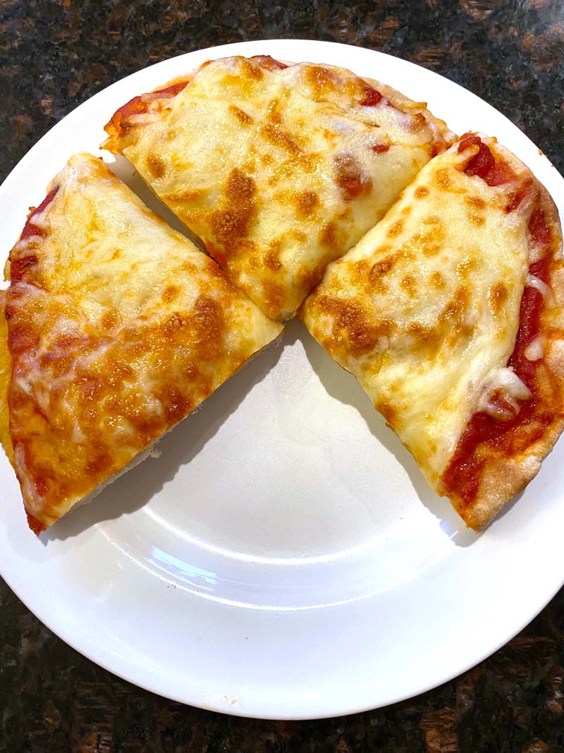 Three slices of pizza on a white plate