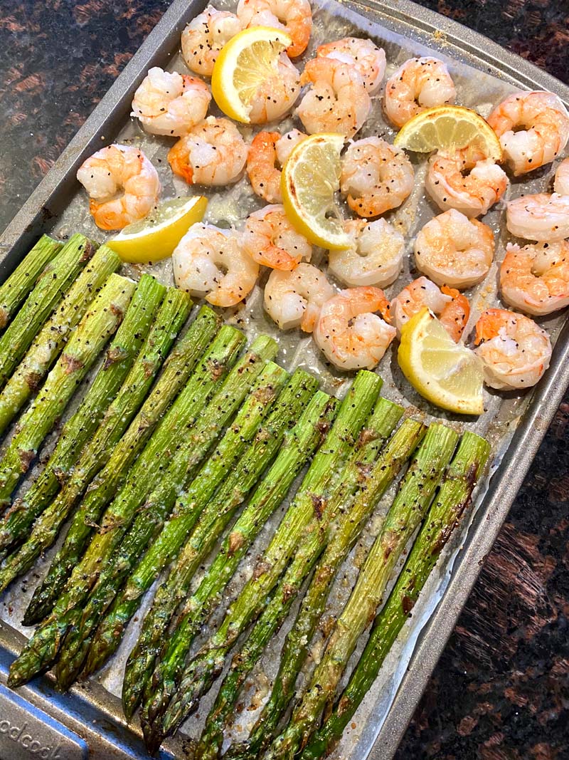 shrimp, lemon and asparagus on a sheet pan