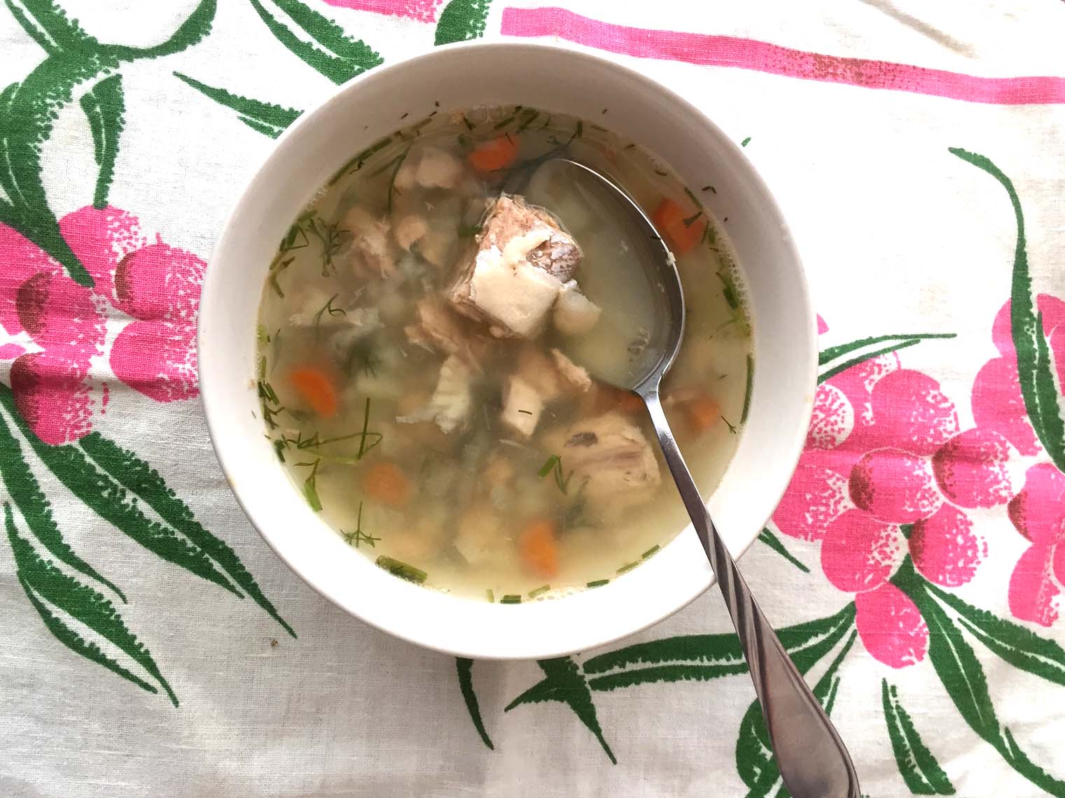 A spoon in the canned salmon soup