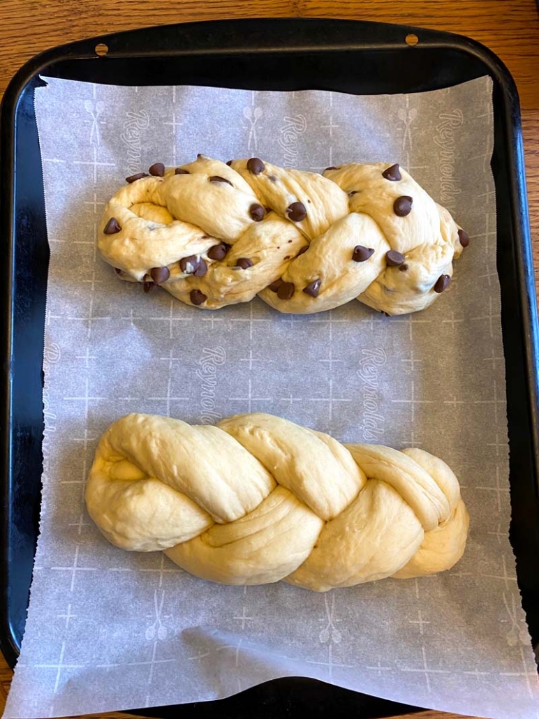 two loaves of challah bread and one with chocolate chips