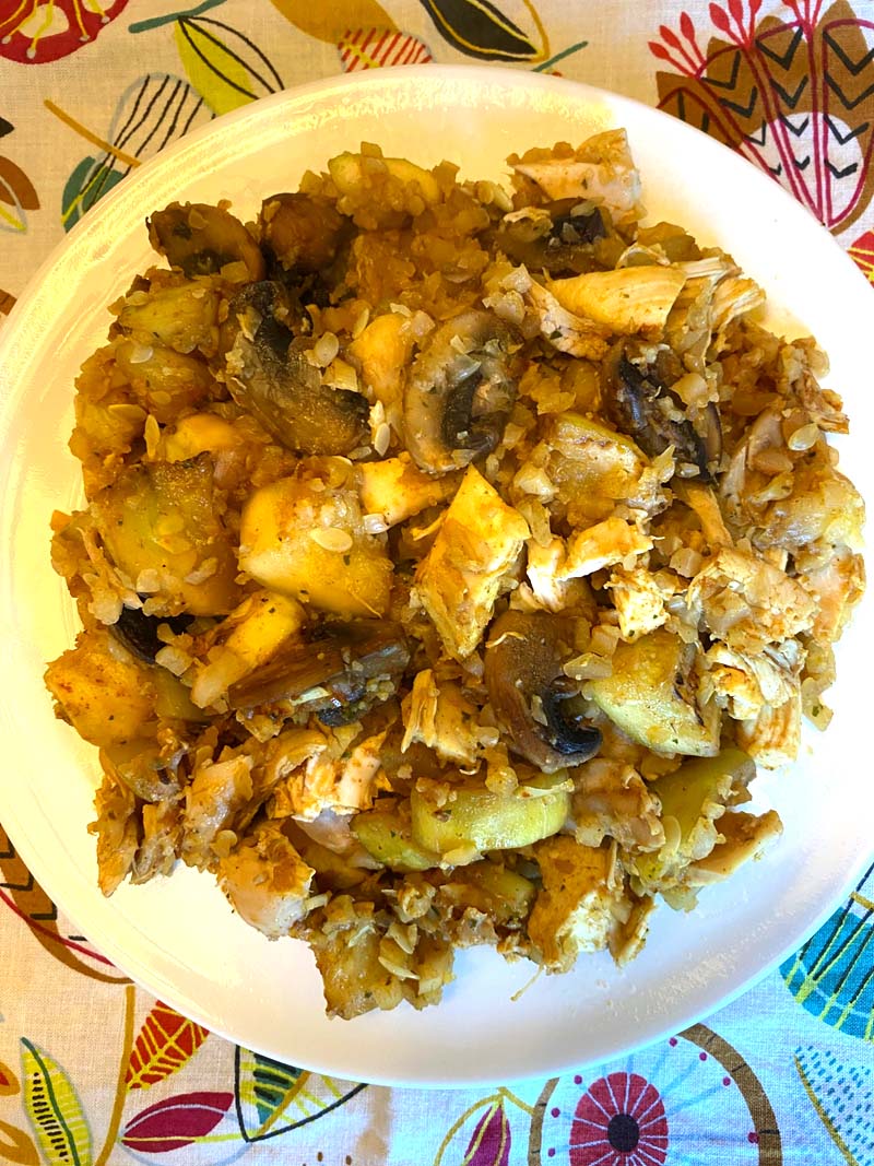 Overhead shot of the cauliflower rice stir fry on a white plate