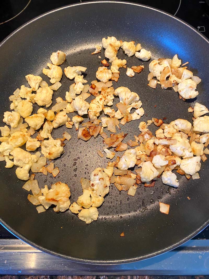 Browned cauliflower in a skillet
