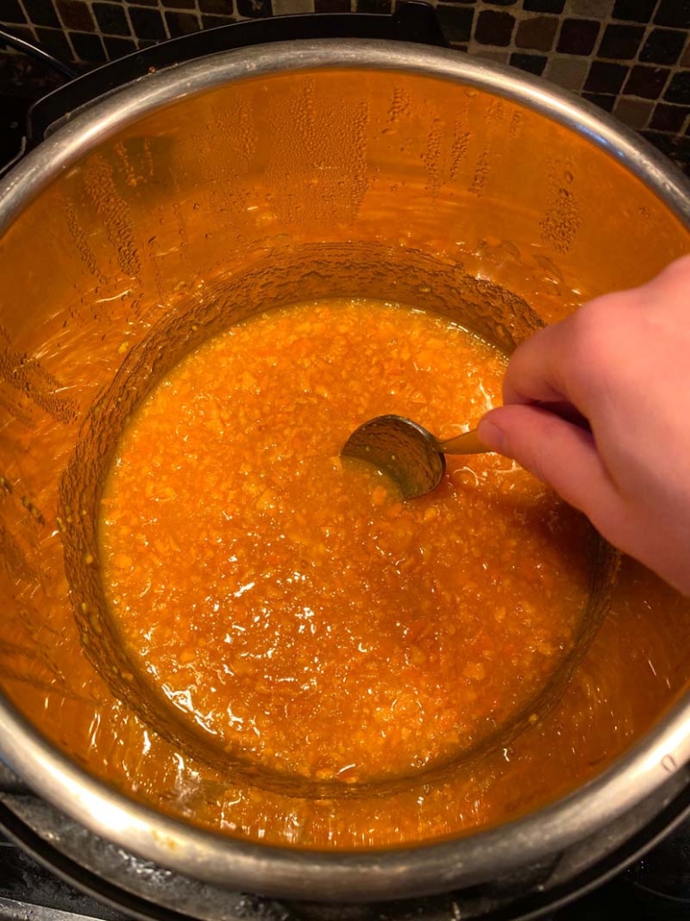 stirring orange marmalade in Instant Pot