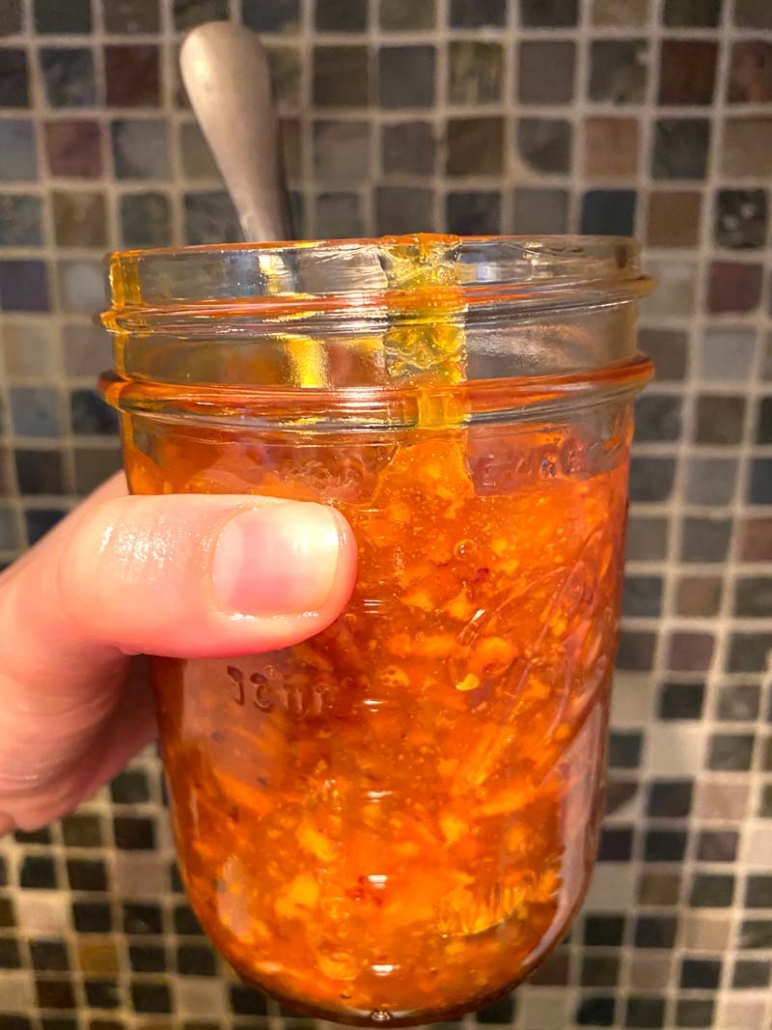 storing orange marmalade in a jar 